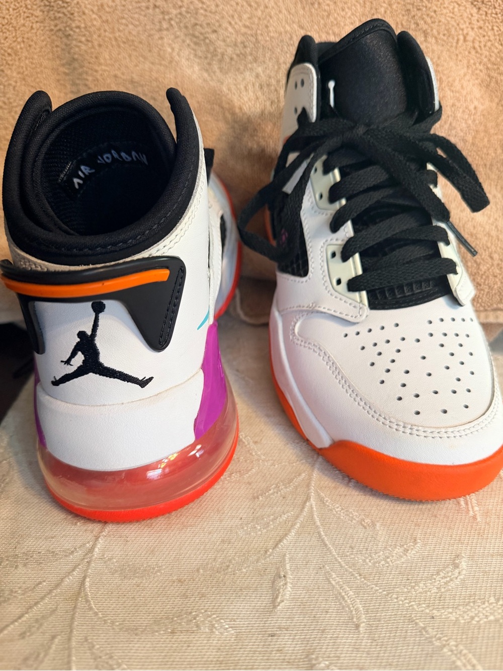 Jordan Kids White High-Top Sneakers with Orange and Purple Accents